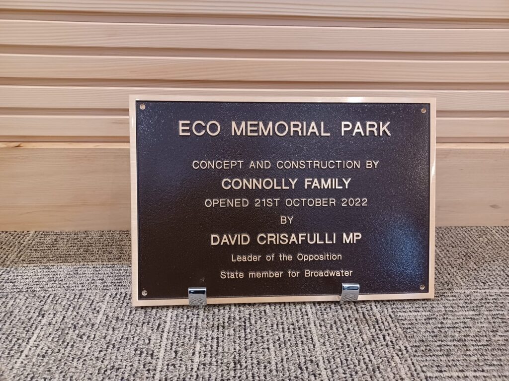 grand opening sign outside new funeral chapel logan
