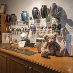 urns, keepsakes and scatter tubes sitting on display table