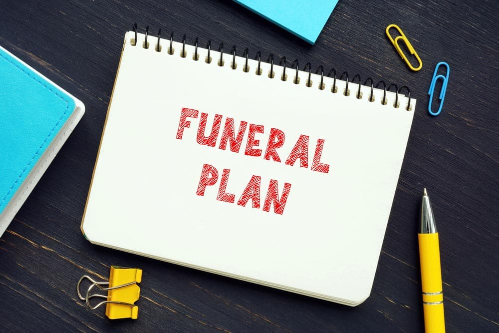Funeral Plan Written On A Notebook