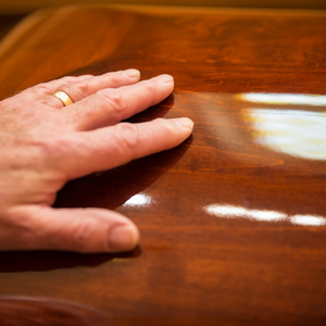 man with wedding ring at funeral