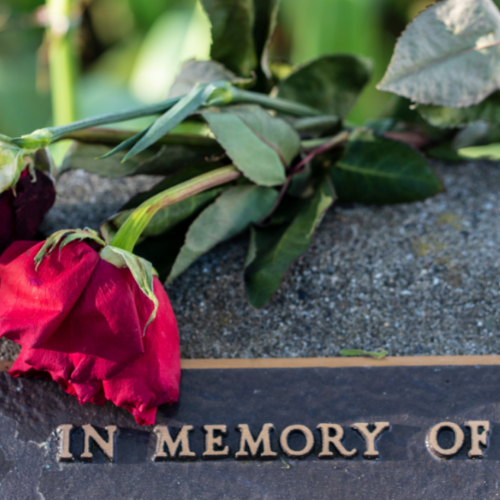 memorial stone with roses at memorial gardens